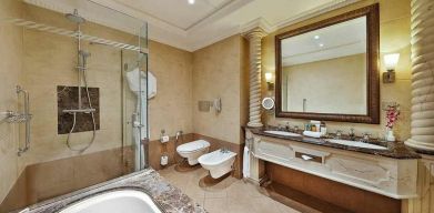 clean and spacious king bathroom with shower and bath at Hilton Beirut Habtoor Grand.