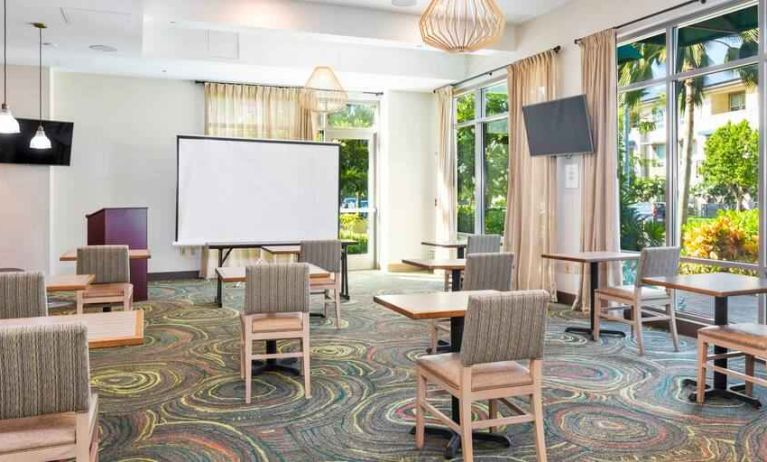 Bright meeting room with large windows at Embassy Suites by Hilton Oahu Kapolei.