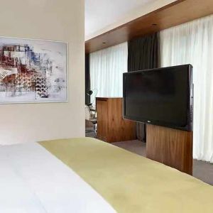 comfortable king room with TV at DoubleTree by Hilton Zagreb.