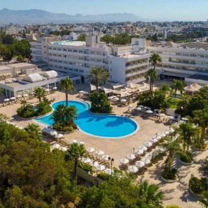 stunning outdoor pool surrounded with sunbeds and umbrellas at Hilton Nicosia.