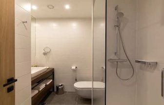 clean and spacious king bathroom with shower at Hilton Garden Inn Zagreb - Radnicka.