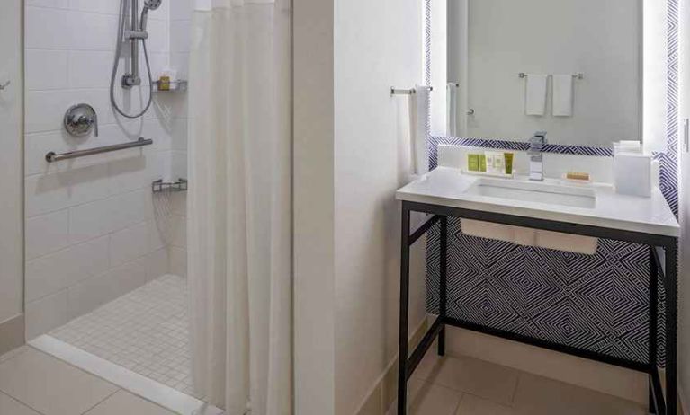 clean and spacious guest bathroom with shower at Hilton Richmond Downtown.