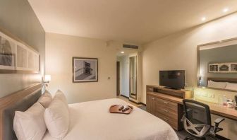 lovely king suite with TV, work desk, and chair at Hampton Inn & Suites by Hilton Salamanca Bajio.