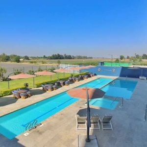 stunning outdoor pool surrounded with sunbeds at Hampton Inn & Suites by Hilton Salamanca Bajio.