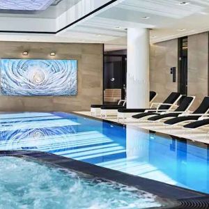 stunning indoor pool with sunbeds at Hilton Tallinn Park.