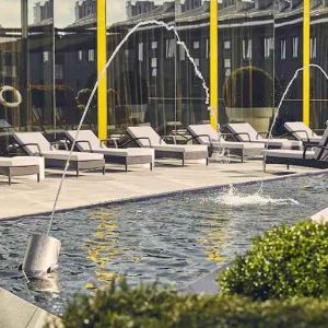 beautiful rooftop terrace with pool-fountain and sunbeds at Hilton Tallinn Park.