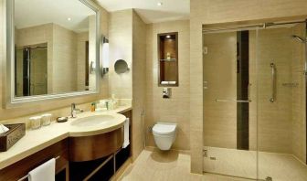 clean and spacious guest bathroom with shower at Hilton Alexandria King's Ranch.