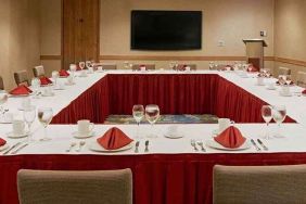 Conference room with square table at Miami International Airport Hotel.