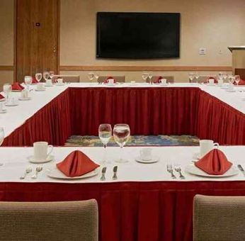 Conference room with square table at Miami International Airport Hotel.