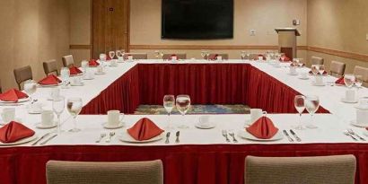 Conference room with square table at Miami International Airport Hotel.