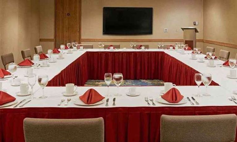 Conference room with square table at Miami International Airport Hotel.