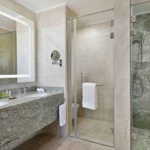 clean and spacious king bathroom with shower at Hilton Hurghada Plaza.