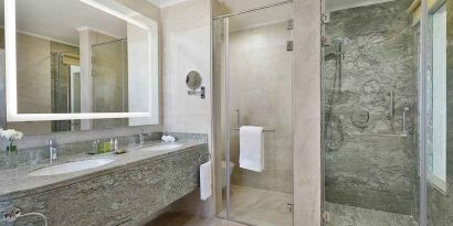 clean and spacious king bathroom with shower at Hilton Hurghada Plaza.