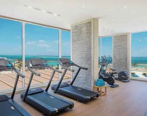 well equipped fitness center with ocean views at Hilton Hurghada Plaza.