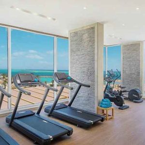 well equipped fitness center with ocean views at Hilton Hurghada Plaza.