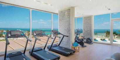 well equipped fitness center with ocean views at Hilton Hurghada Plaza.