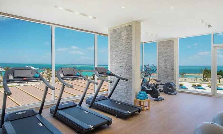 well equipped fitness center with ocean views at Hilton Hurghada Plaza.