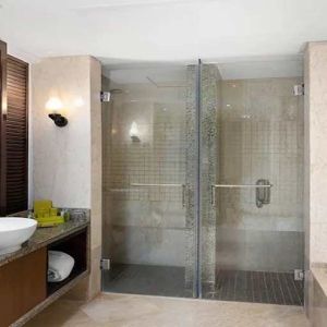 clean and spacious king bathroom with shower and bath at Hilton Luxor Resort & Spa.