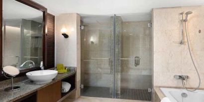 clean and spacious king bathroom with shower and bath at Hilton Luxor Resort & Spa.