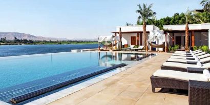 stunning outdoor pool with sunbeds at Hilton Luxor Resort & Spa.