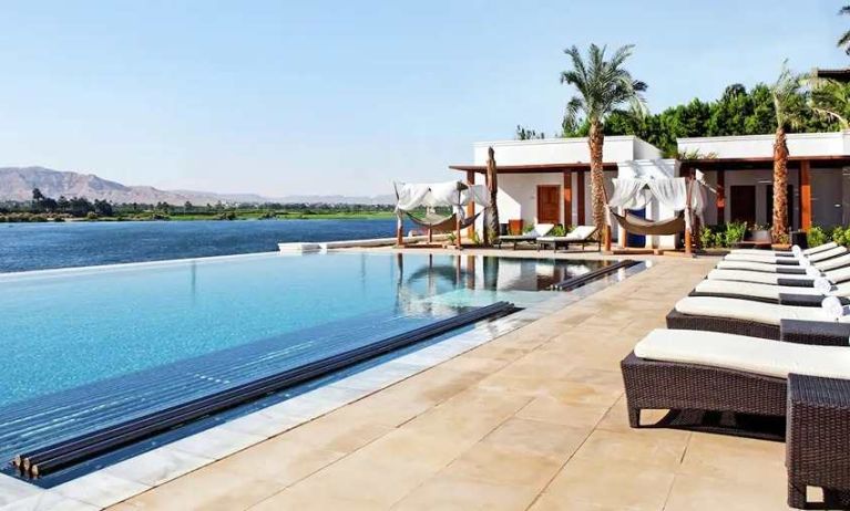 stunning outdoor pool with sunbeds at Hilton Luxor Resort & Spa.