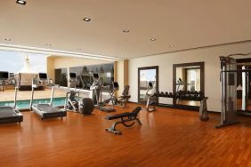 Exercise room with treadmills, free weights, weigth machines, and plenty of space to stretch out and do yoga.