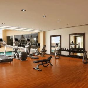 Exercise room with treadmills, free weights, weigth machines, and plenty of space to stretch out and do yoga.