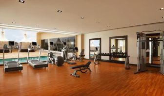 Exercise room with treadmills, free weights, weigth machines, and plenty of space to stretch out and do yoga.