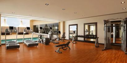 Exercise room with treadmills, free weights, weigth machines, and plenty of space to stretch out and do yoga.