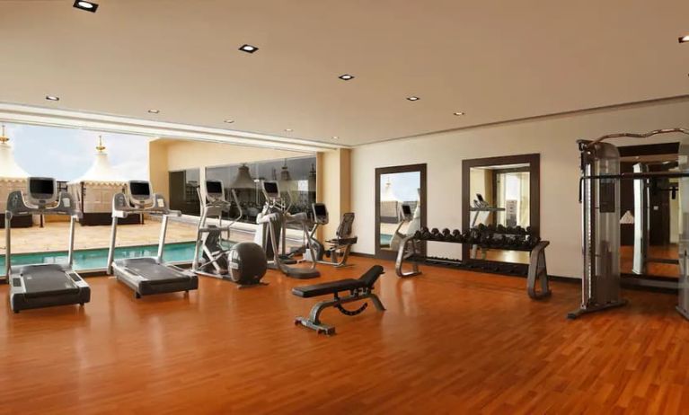 Exercise room with treadmills, free weights, weigth machines, and plenty of space to stretch out and do yoga.