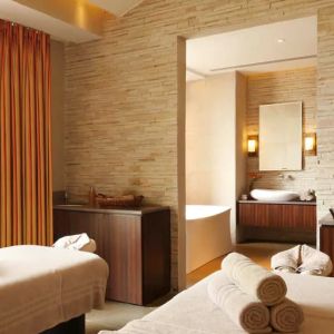 Beautiful brick-lined room with space for two massage tables, and a large view of Jaipur, India.