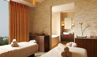 Beautiful brick-lined room with space for two massage tables, and a large view of Jaipur, India.