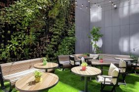 pretty outdoor terrace with seating area ideal for coworking at Hilton Garden Inn Budapest City Centre.