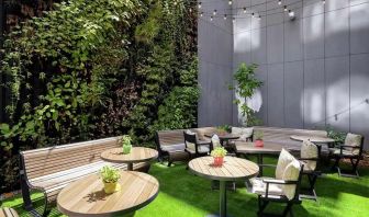 pretty outdoor terrace with seating area ideal for coworking at Hilton Garden Inn Budapest City Centre.