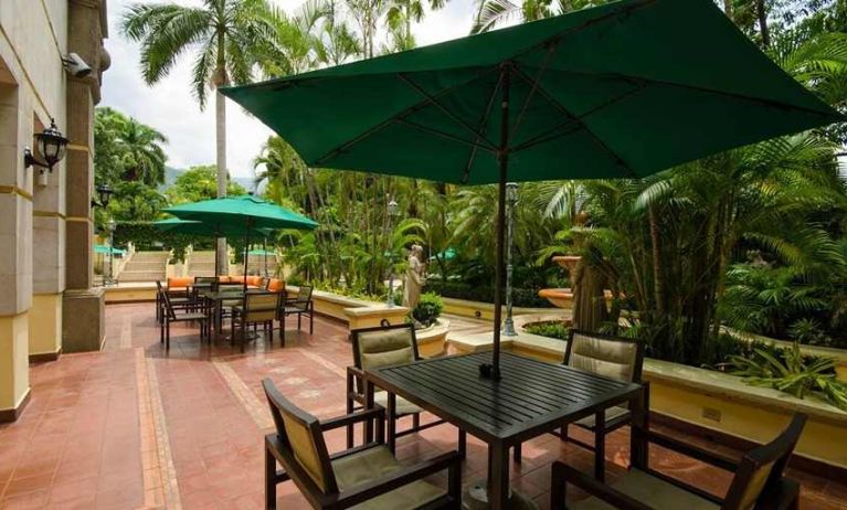 pretty outdoor terrace with seating area ideal for coworking at Hilton Princess San Pedro Sula.