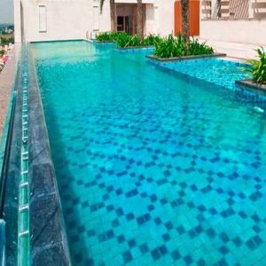 stunning outdoor pool with city views at Hilton Chennai.