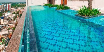 stunning outdoor pool with city views at Hilton Chennai.