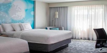 Comfortable queen room with business desk at Sonesta Select Atlanta Norcross I-85.