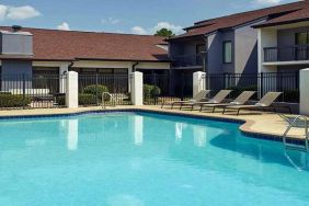 Stunning outdoor pool with sunbeds at Sonesta Select Atlanta Norcross I-85.