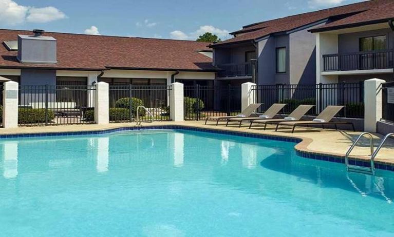 Stunning outdoor pool with sunbeds at Sonesta Select Atlanta Norcross I-85.