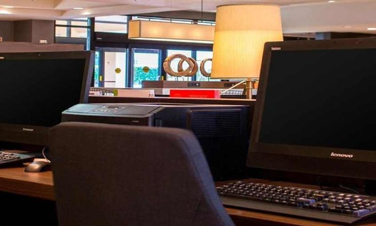 Dedicated business center and workspace with PC, internet, and printer at Sonesta Select Atlanta Norcross I-85.