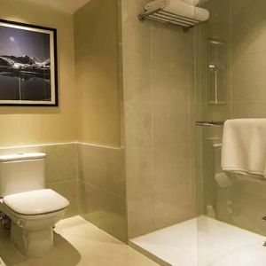 clean and spacious guest bathroom with shower at Hilton Garden Inn Trivandrum.