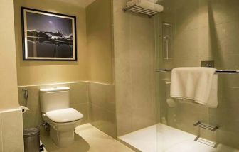 clean and spacious guest bathroom with shower at Hilton Garden Inn Trivandrum.