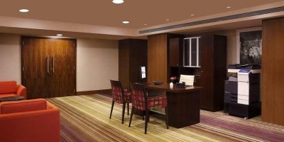 dedicated business center with PC, business desk, printer, and internet at Hilton Garden Inn Trivandrum.