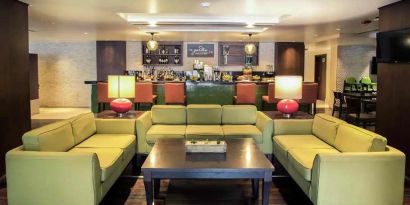 comfortable lobby and lounge area ideal for coworking at Hilton Garden Inn Trivandrum.