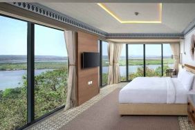 luxurious king suite with TV and gorgeous nature views at DoubleTree by Hilton Goa - Panaji.