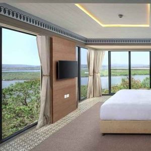 luxurious king suite with TV and gorgeous nature views at DoubleTree by Hilton Goa - Panaji.