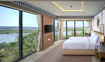 luxurious king suite with TV and gorgeous nature views at DoubleTree by Hilton Goa - Panaji.