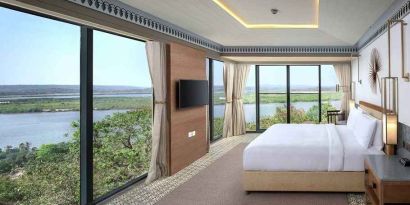 luxurious king suite with TV and gorgeous nature views at DoubleTree by Hilton Goa - Panaji.