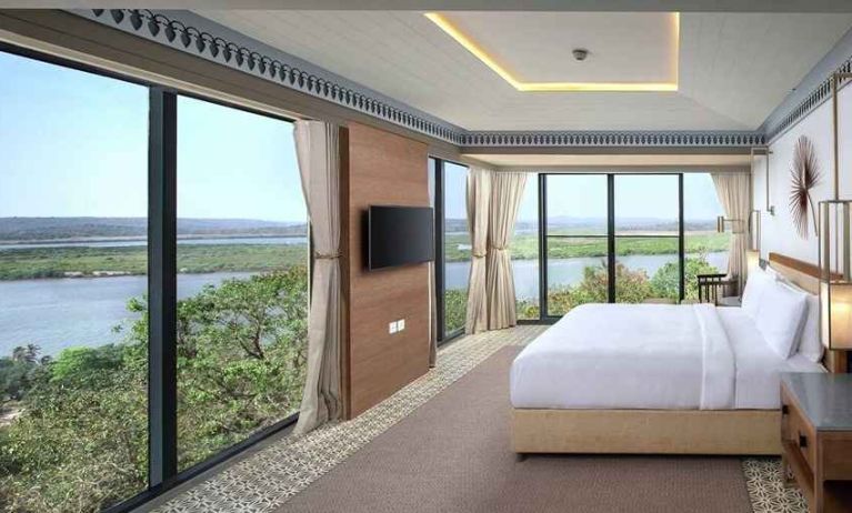 luxurious king suite with TV and gorgeous nature views at DoubleTree by Hilton Goa - Panaji.